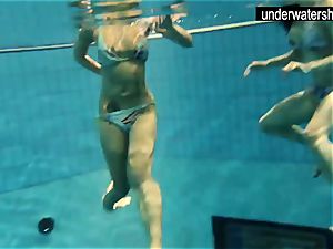 two killer amateurs showing their figures off under water
