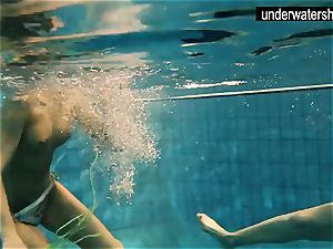 two killer amateurs showing their figures off under water